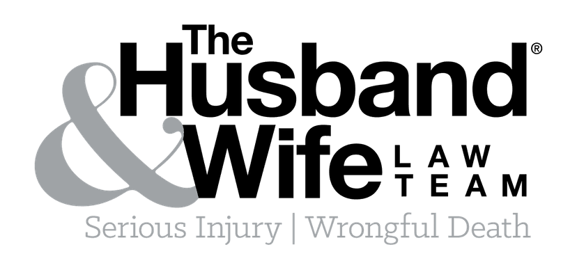The Husband & Wife Law Team logo in black and grey text