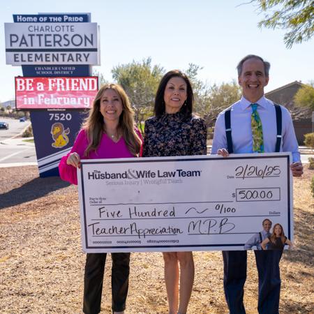 Mark Breyer, Alexis Breyer, and Ms. Barz holding an oversized check for $500